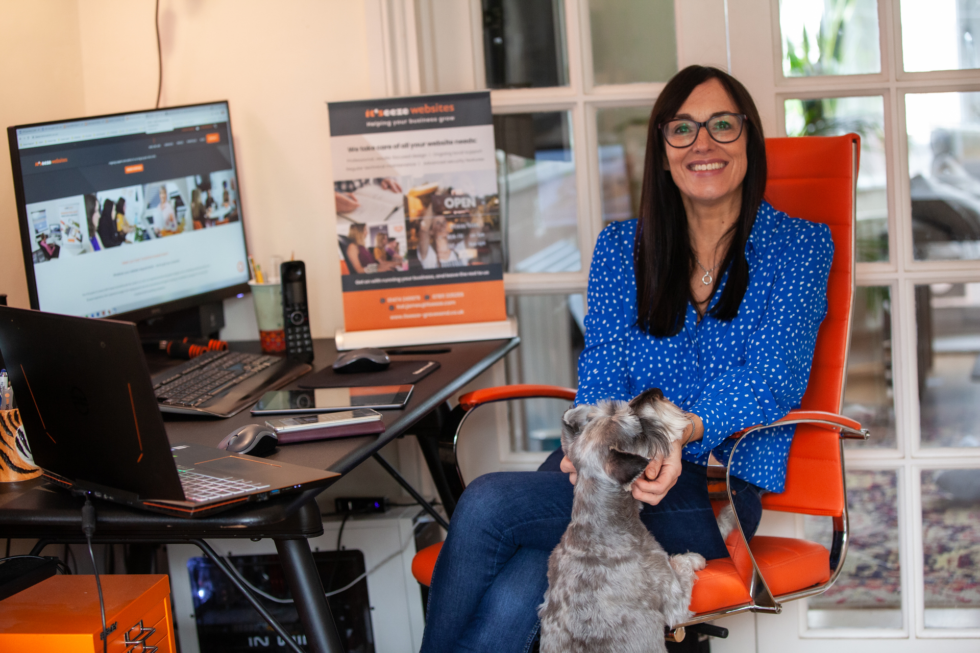 Gravesend web consultant Kat James sat at her desk with her dog